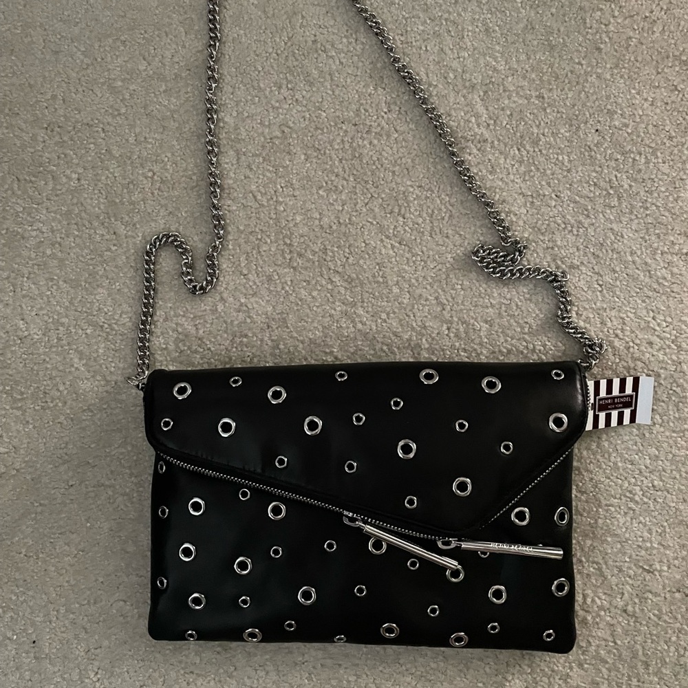 Henri Bendel’s black/ silver grommet purse